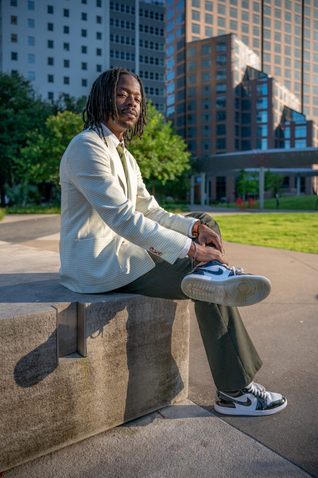 Urban brand portrait - business professional seated downtown